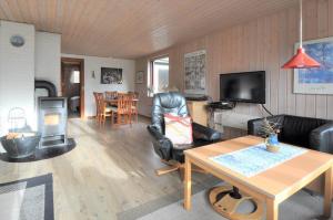 a living room with a couch and a table at 30061-Ulfborg-Kaprifolievej-6 in Ulfborg