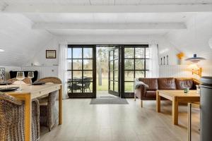 a living room with a couch and a table at 20356-Ulfborg-Lars-Murersvej-9 in Ulfborg