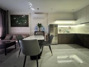 a kitchen and living room with a table and chairs at VHGP-Bs10 in Long Bình
