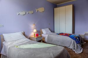 Postel nebo postele na pokoji v ubytování Villetta Dino