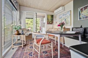 a living room with a table and a dining room at SL324-Slagelse-Strandvaenget-29 in Slagelse