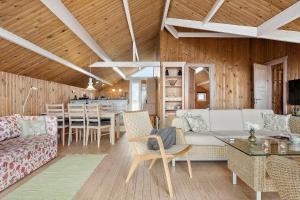 a living room with a couch and a table at SL308-Slagelse-Jarlsvej-23 in Slagelse