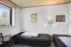 a bedroom with two beds and a window at SL122-Slagelse-Delfivej-6 in Slagelse