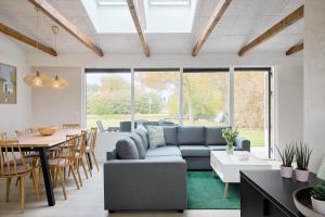 a living room with a couch and a table at SL301-Korsor-Strandengen-1 in Korsør