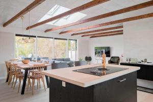 a kitchen and living room with a table and chairs at SL301-Korsor-Strandengen-1 in Korsør +16 photos