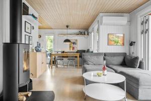 a living room with a couch and a table at SL325-Slagelse-Ringduevej-6 in Slagelse +18 photos