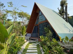 a house in the middle of a garden at Uniton Zen Garden in Ấp Bến Cầu