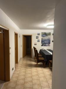 a dining room with a table and chairs in it at Little Rostock in Papendorf +3 photos