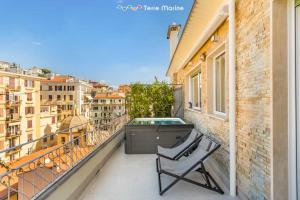 a balcony with a chair and a pool on a building at Suite Level 8, Terre Marine in La Spezia +7 photos