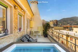 a balcony with a swimming pool on a building at Suite Level 8, Terre Marine in La Spezia