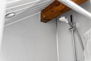 a shower in a bathroom with a shower head at K20063-Store-Fuglede-Ostvej-6 in Store Fuglede +15 photos