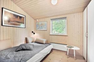 a small bedroom with a bed and a table at K19045-Kalundborg-Lobelievej-3 in Kalundborg