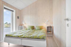 a bedroom with a bed in a room with a window at SL296-Slagelse-Athenesvej-7 in Slagelse