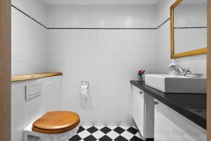 a bathroom with a toilet and a sink at SL341-Skaelskor-Glaenovej-140 in Skælskør +26 photos