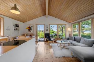 a living room with a couch and a table at SL347-Korsor-Tvaerager-9 in Korsør