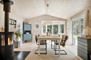 a kitchen and dining room with a table and chairs at K20092-Gorlev-Skovhusvej-27 in Gørlev