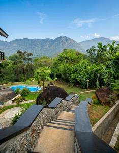 a resort with a view of the mountains at Visbury Villa in Gangaboda