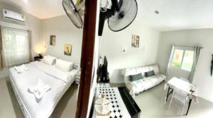 a living room with a bed and a couch at Yada House s&h in Nai Yang Beach
