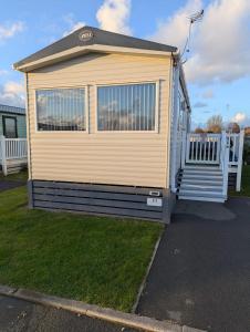a mobile home is parked in a yard at Arnside abode in Morecambe
