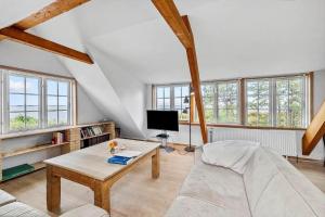 a living room with a couch and a table at SL349-Slagelse-Kongsmarkvej-259 in Slagelse