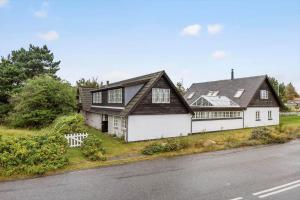 a large white house with a black roof at SL349-Slagelse-Kongsmarkvej-259 in Slagelse