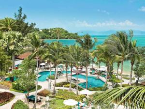 an aerial view of a resort with palm trees and the ocean at ibis Samui Bophut Hotel in Bophut