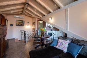 a living room with a couch and a table at Antaeus Old Town Residence in Dubrovnik