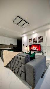 a living room with a couch and a fireplace at Cozy Clark Stay 3BR Condo in Clark