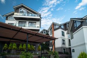 an image of a house with a building at Zenora Hillside Garden in Da Lat