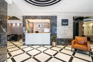 an office lobby with a reception desk and a chair at Nivasole Lara Pure Comfort & Style in Antalya +47 photos