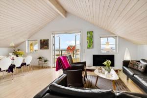 a living room with a couch and a table at 20124-Samso-Maarup-Havn-3 in Nordby