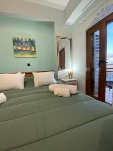 a large bed in a room with a window at Vattediko in Pyrgi