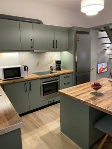 a kitchen with stainless steel appliances and a counter top at Vattediko in Pyrgi