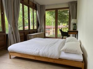 a bedroom with a bed and a window at Santi Villa Wat Seree in Ko Phangan +40 photos
