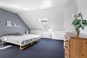 a bedroom with a bed in a room at 20212-Samso-Saelvig-50 in Sælvig