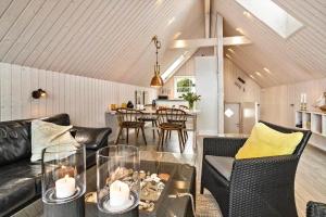 a living room with a couch and a table at 20123-Samso-Maarup-Havn-7-A in Nordby