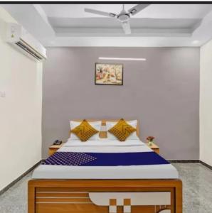 a bedroom with a large bed in a room at Hotel krishna in Mānsa