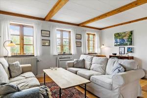 a living room with a couch and a table at 20206-Samso-Haardmark-Mark-7 in Kolby Kås