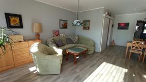 a living room with a couch and a table at FW Wölfer in Velten