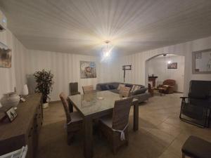 a living room with a table and a couch at villa gambotti in Morta