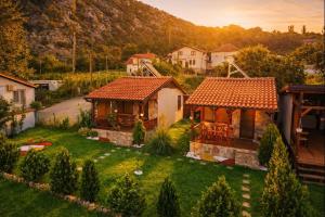 an aerial view of a house with a yard at Karali Apartments in Lagadin