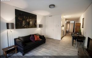 a living room with a couch and a table at Stationsstraat 4H in Amersfoort +7 photos