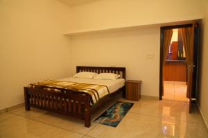 a bedroom with a bed in a room at pathayil villa in Thekkady