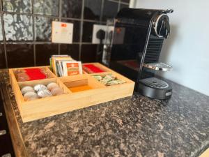a kitchen counter with a box of eggs and a phone at Heatherlea Cottage in Skigersta +24 photos