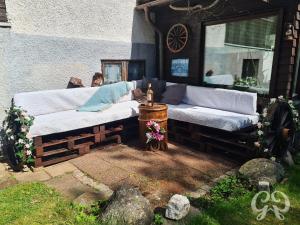 a couple of beds sitting outside of a building at Romantic get-away in Mölnlycke +19 photos