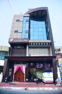 a large building with a sign that reads grand inn at Hotel Grand Inn in Lucknow