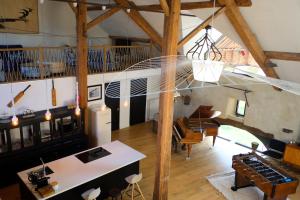 an overhead view of a living room and dining room at Au Petit Bercail - Le Loft - Gite pour 4 personnes in Chiny