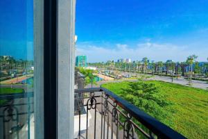 a balcony with a view of a park at Thời đại Hotel in Thanh Hóa