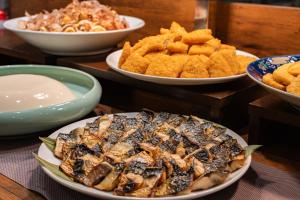a table with plates of food and bowls of food at Hotel Keihan Tenmabashi in Osaka +31 photos
