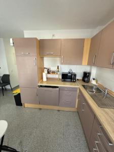 a kitchen with a sink and a counter top at Team at Home Senden in Senden
